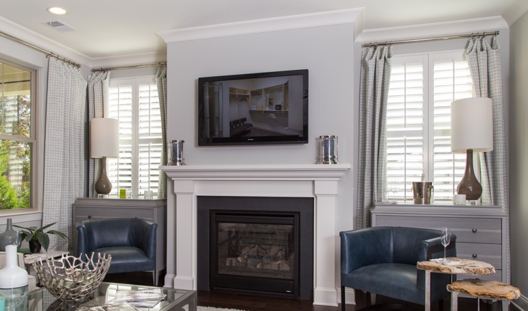Detroit fireplace with white shutters.